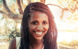 woman smiling in sunshine photo